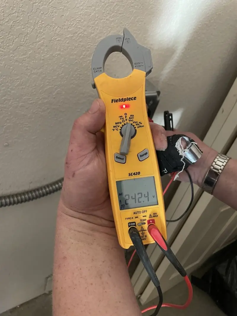 Voltage testing with clamp meter during Circuit Breaker Repair in Dry Ridge